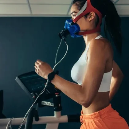 Woman running on treadmill with oxygen mask | Aesura Health